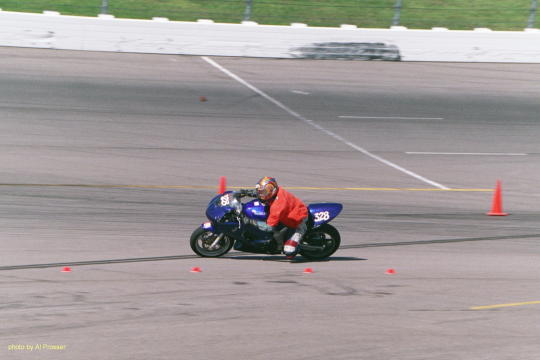Chase Rider on Suzuki in turn one, inside shot