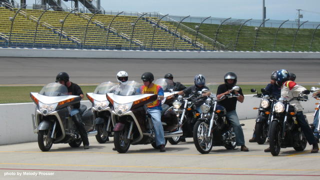 Group of riders getting ready to go on track