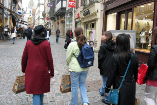 Street with big clock in Rouen